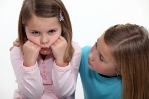 bigstock-A-little-girl-trying-to-cheer--32054174