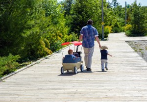 Father And Sons On The Boardwalk.